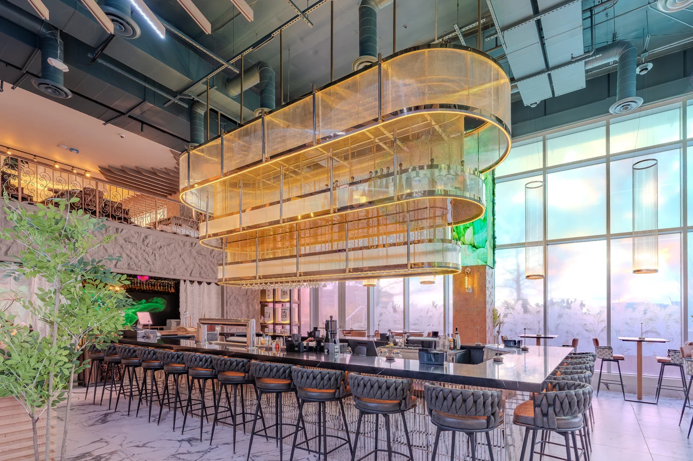 Churasuko central bar beneath curved brass lighting