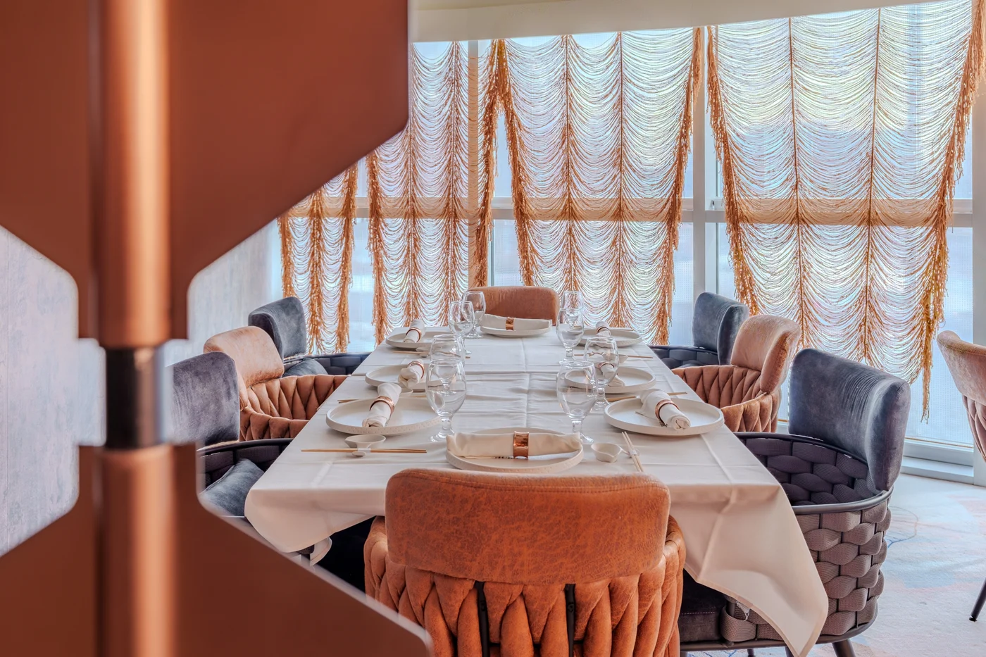 An intimate private dining table framed by Churasuko’s flowing curtains